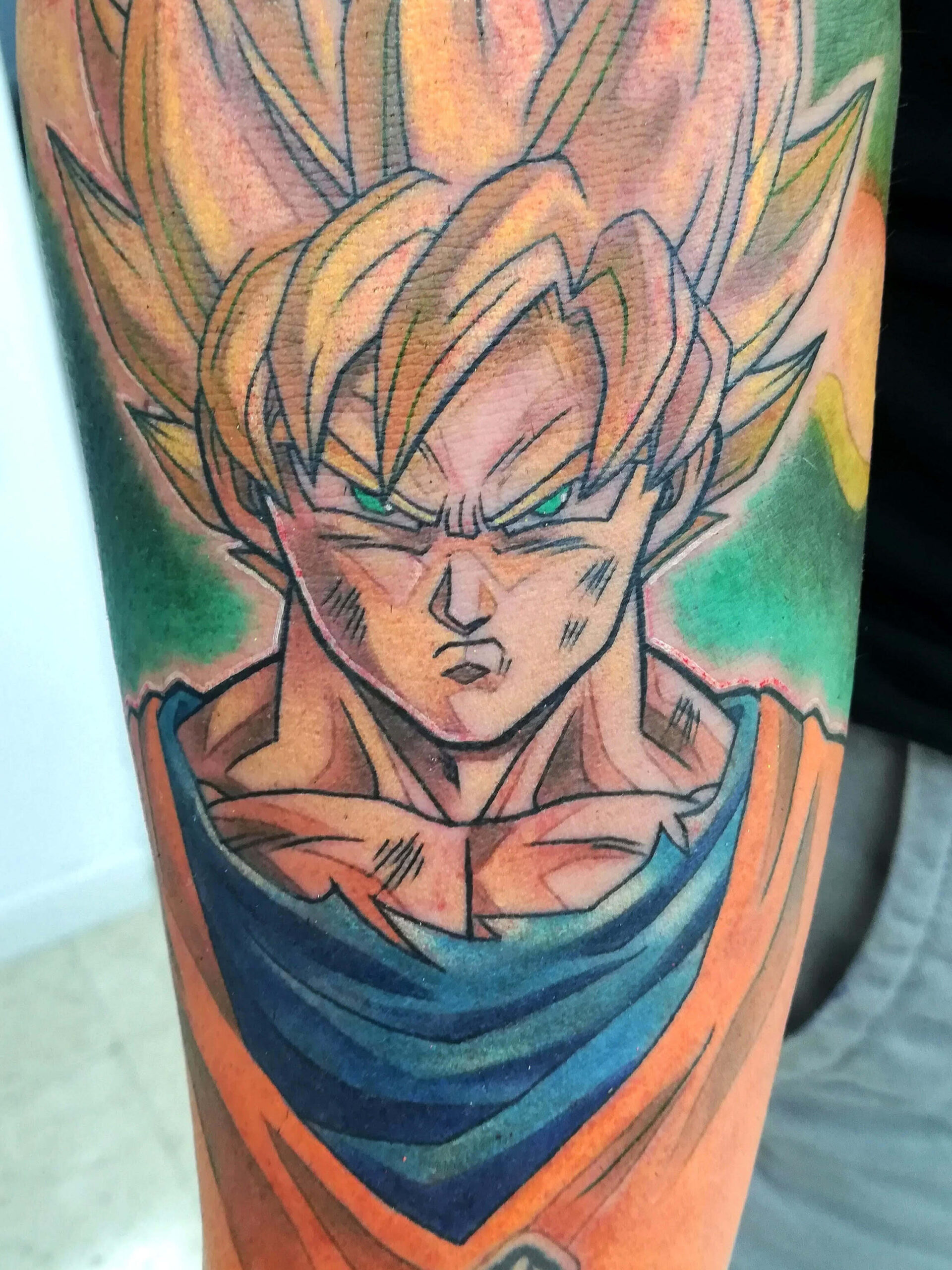Goku en Super Saiyan. Tatuaje en color por Lily Bone
